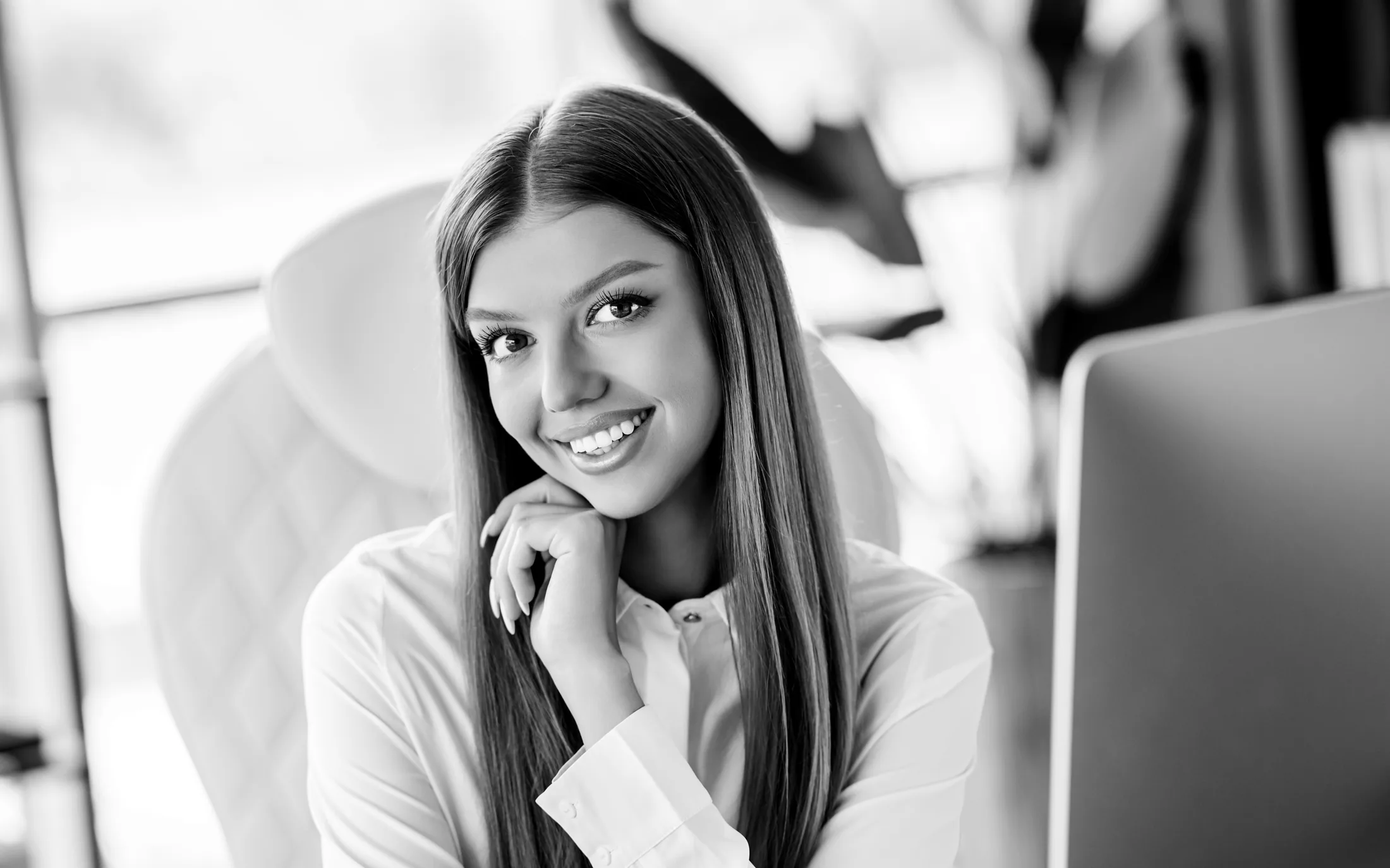 Black-and-white phone support specialist wearing a headset